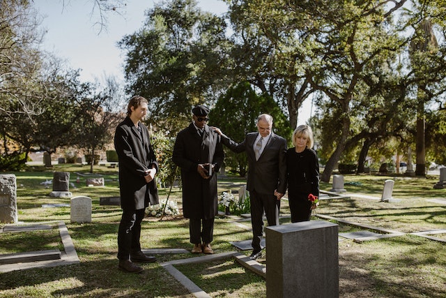 pexels-rdne-stock-project-6841459 four people at a cemetary
