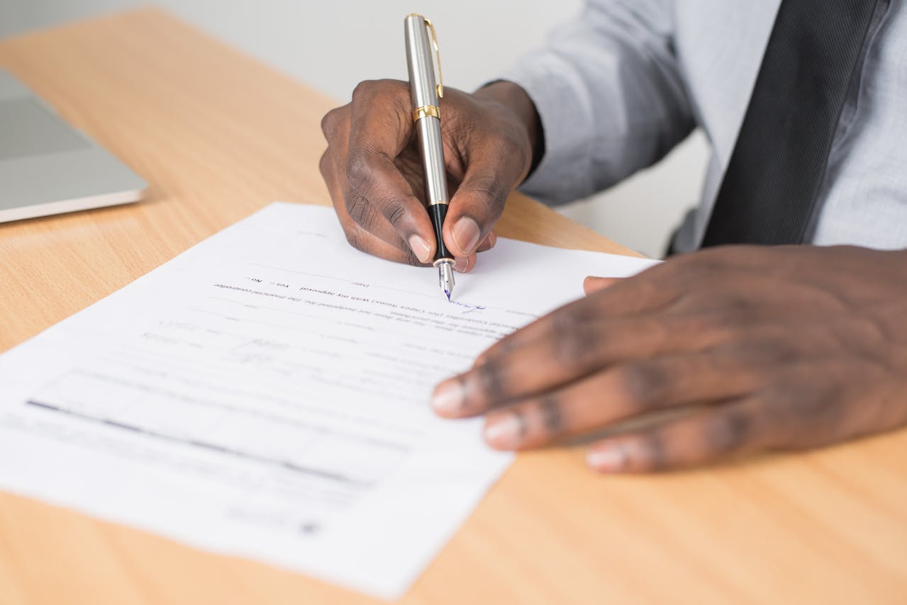 Reside-Rentals-signing-documents